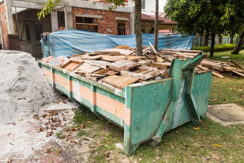 Professionals organizing items during house clearance in Bexley