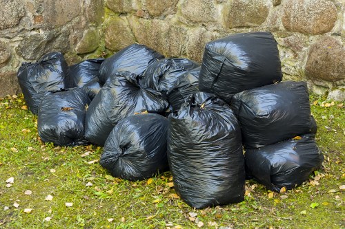 Waste collection services sorting items on-site in a probate house