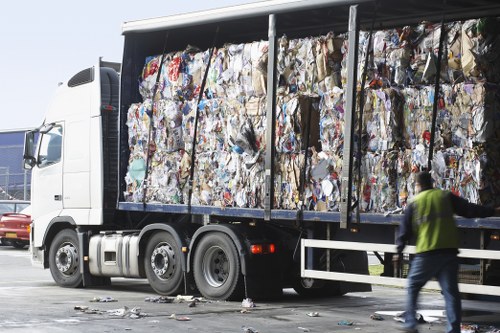 Professional waste clearance team in a residential home