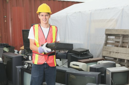 Clearance workers sorting household items