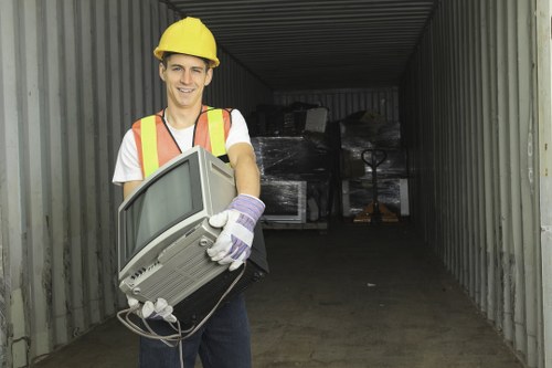 Efficient house clearance team working in a Leamouth home